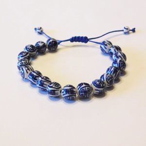 Asian Themed Adjustable String Bracelet - Like new